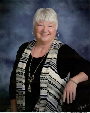 Photo of Dorothy Fletcher wearing black shirt and stripped vest